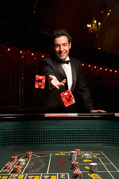Live dealer showing three-card hand to player